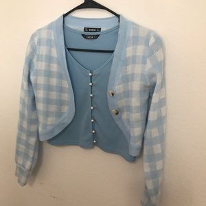 A baby blue pearl button up top with a baby blue plaid cardigan from Shein